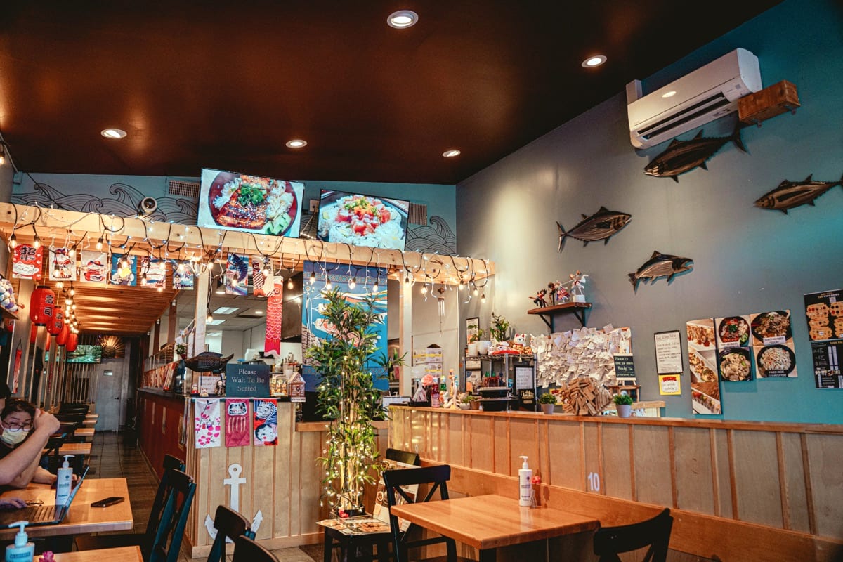 Inside LuvFish on Harbor Boulevard: wood counters, lanterns, fish wall art